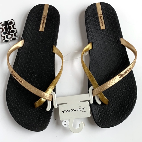 black and gold flip flops